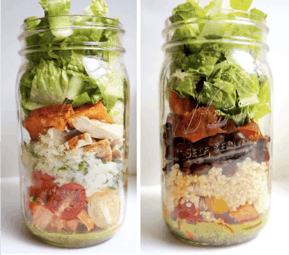 Two mason jars filled with burrito bowl salads
