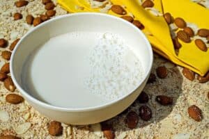 A bowl of freshly made almond milk. Learn how to eliminate dairy from your diet, like using nut milk alternatives.