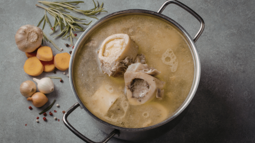 Happy Belly Health, Shanti Pappas, Bone Broth Benefits_ Why You Should Add This Superfood to Your Diet, Cooking pot with bones and vegetables simmering