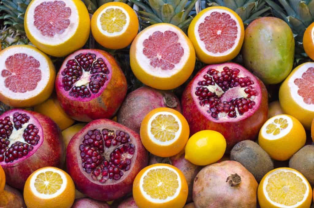 Various citrus fruits sliced open. Citrus fruits can help optimize your health.